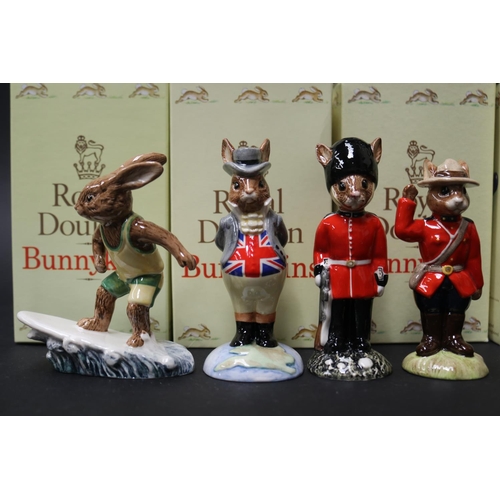 5246 - Royal Doulton Bunnykins, John Bull, Guardsman, Mountie and Aussie Surfer, approx 11cm H and shorter ... 