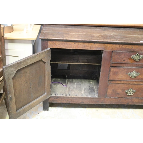 2011 - Antique 18th century English Georgian oak dresser base, three central graduating drawers, flanked by... 