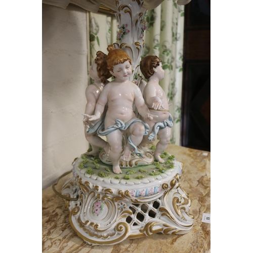2096 - Italian Meissen style figural porcelain lamp, the centre mounted with four semi clad putti, elaborat... 