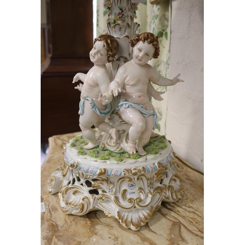 2096 - Italian Meissen style figural porcelain lamp, the centre mounted with four semi clad putti, elaborat... 