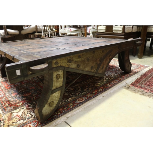 2107 - Large Indian cart top coffee table, with applied hand beaten brass and steel decoration, approx 41cm... 