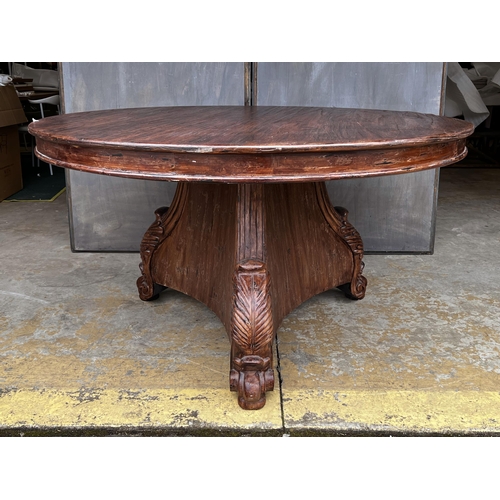 2265 - American oak finished circular dining table walnut colour, in the Empire style, approx 78cm H x 140c... 