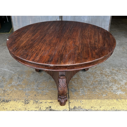 2265 - American oak finished circular dining table walnut colour, in the Empire style, approx 78cm H x 140c... 