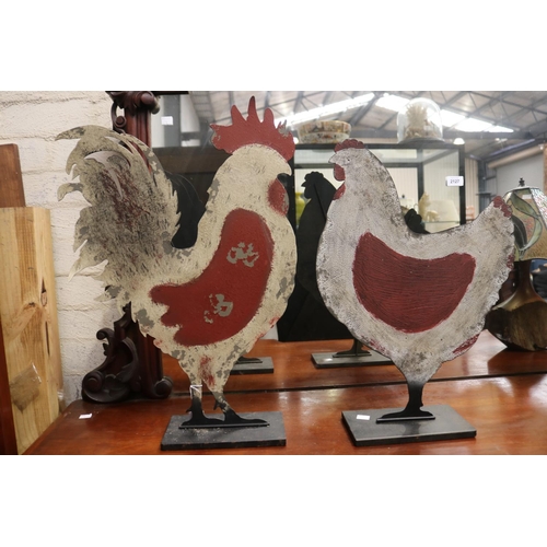 2126 - Two decorative metal cut outs of a rooster and hen, approx 59cm H x 41cm W and smaller (2)