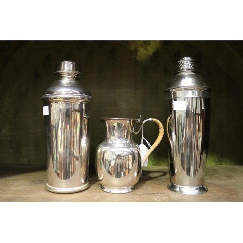 2116 - Two cocktail shakers and a milk jug, approx 25cm H and shorter (3)