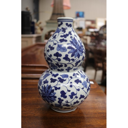 2270 - Two modern decorative blue & white vases, approx 29cm H and shorter (2)