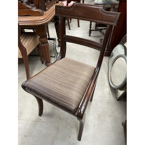 2425 - Set of six English mahogany dining chairs with a shaped back and sabre front legs and drop-in seats ... 