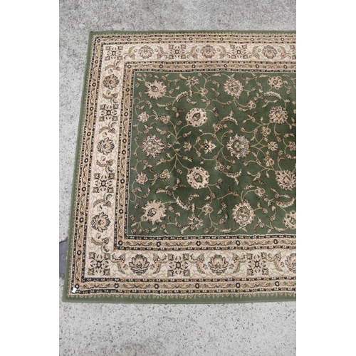 2458 - Green and beige carpet, approx 229cm x 160cm