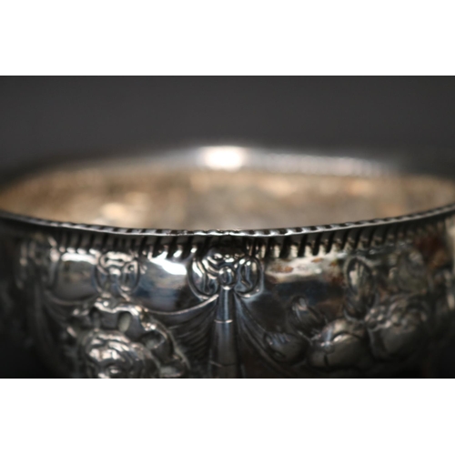 14 - Antique sterling marked tri footed bowl, with repousse decoration swags of fruit and mask head mount... 