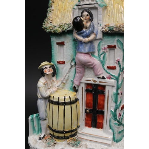 21 - Victorian large Staffordshire group of lovers at a window with father below, approx 31cm H x 19cm W