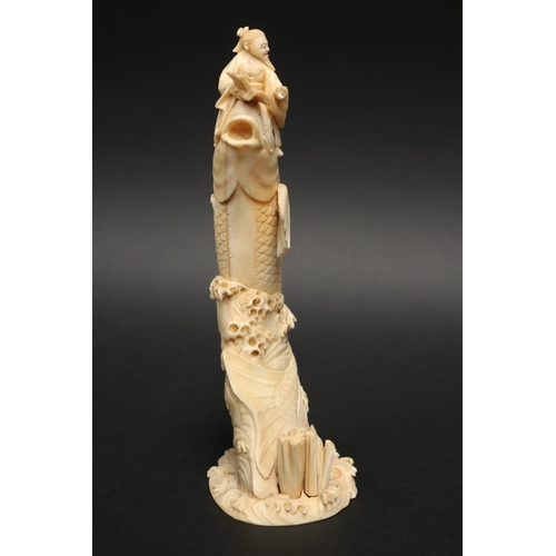 23 - Fine Japanese Tokyo school ivory carved figure, of a scholar riding a carp on a sea carved base, app... 