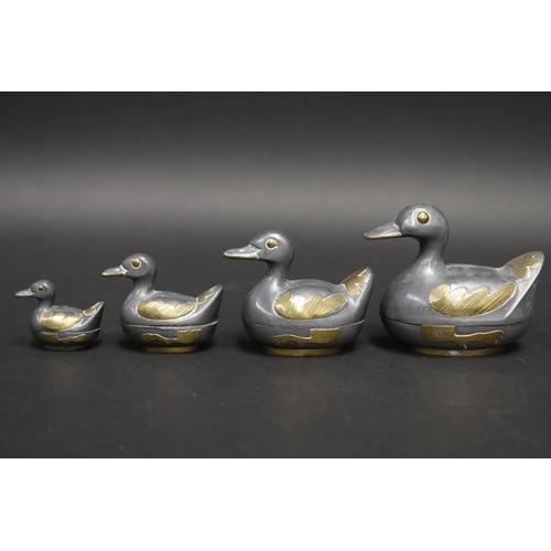 63 - Set of four graduating pewter and brass duck boxes, approx 8cm H x 9.5cm W and smaller (4)