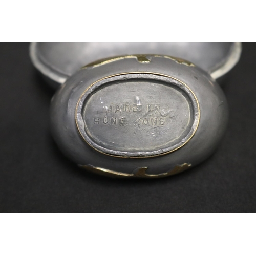 63 - Set of four graduating pewter and brass duck boxes, approx 8cm H x 9.5cm W and smaller (4)