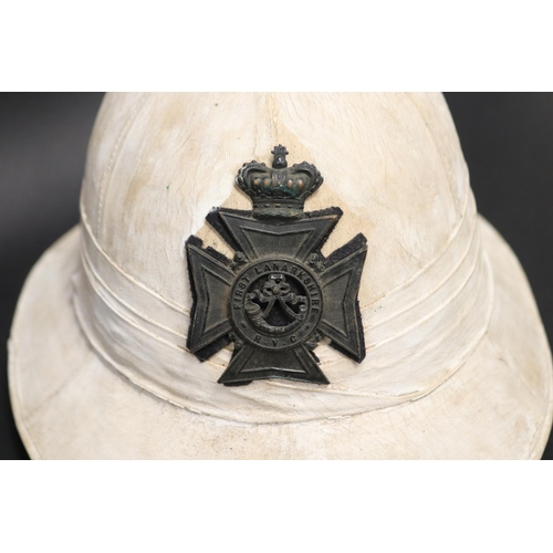 69 - First World War British Army Wolseley pattern pith helmet, with leather headband marked E.Z. Bloomfi... 