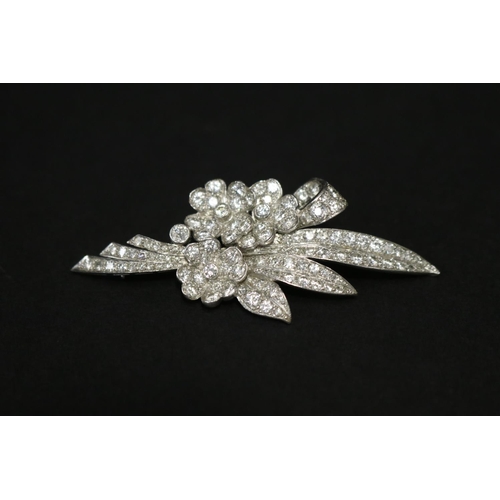 Fine vintage diamond and 18ct white gold floral spray brooch, form of a stylised bouquet of flowers and leaves tied with a ribbon, approx total weight 13 grams, no valuation. Purchased from Hardy Brothers, Melbourne