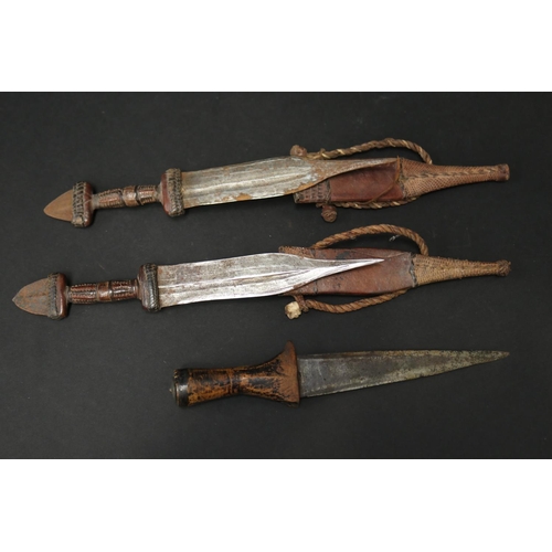 72 - Selection of 20th century North African steel and leather daggers, approx 48cm L and shorter (5)