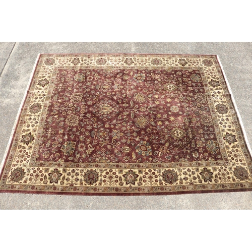 327 - Large good quality Indian wool carpet of autumn tone, approx 272cm x 363cm