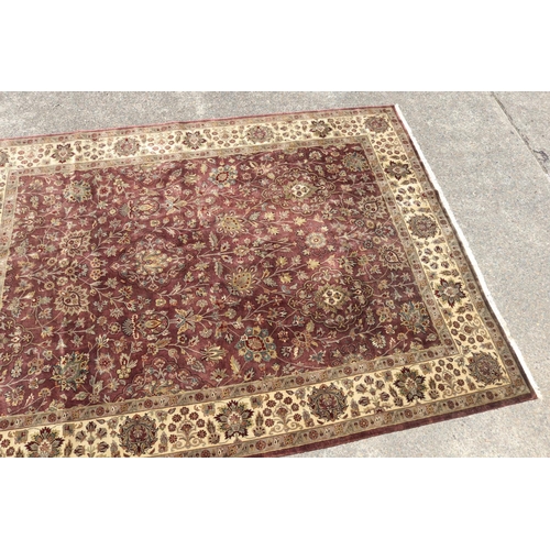 327 - Large good quality Indian wool carpet of autumn tone, approx 272cm x 363cm