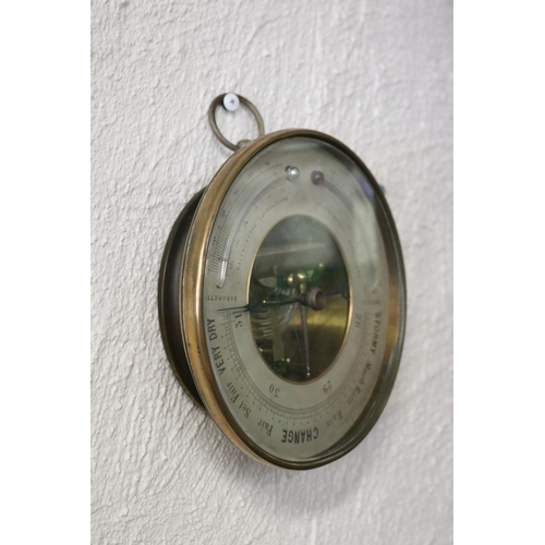272 - Antique brass cased aneroid barometer, unmarked, approx 20cm Dia