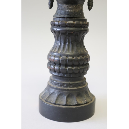 295 - South East Asian bronze Buddha head on carved turned wood stand, approx 32cm H including stand