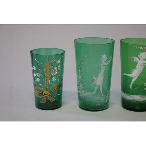 219 - Four antique Mary Gregory dark green beakers (4)