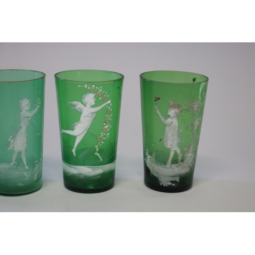 219 - Four antique Mary Gregory dark green beakers (4)