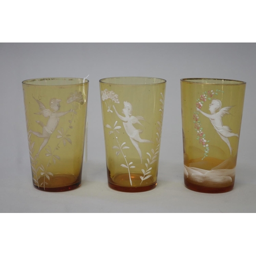 225 - Three antique Mary Gregory amber glass beakers (3)