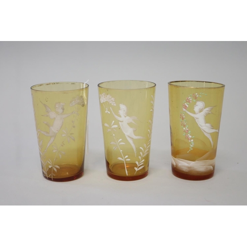 225 - Three antique Mary Gregory amber glass beakers (3)