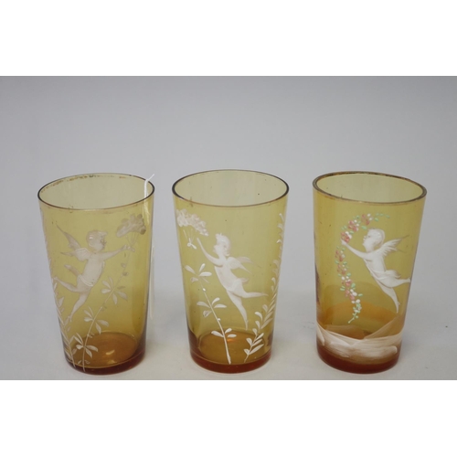 225 - Three antique Mary Gregory amber glass beakers (3)