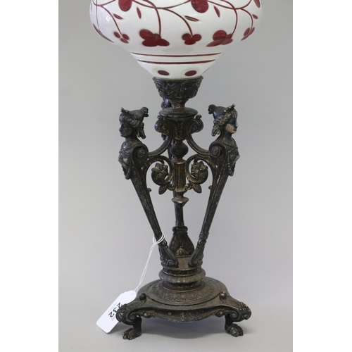 232 - Antique Victorian triform female term support oil lamp, with an overlay ruby glass reservoir, approx... 