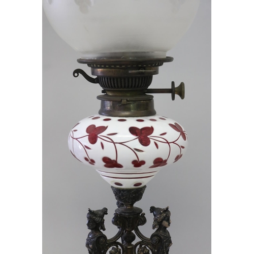 232 - Antique Victorian triform female term support oil lamp, with an overlay ruby glass reservoir, approx... 