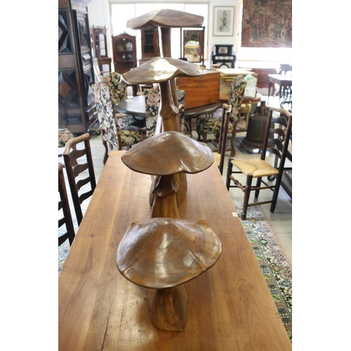 307 - Set of four large decorative carved walnut toadstools, of graduating size, approx 97cm H and shorter... 