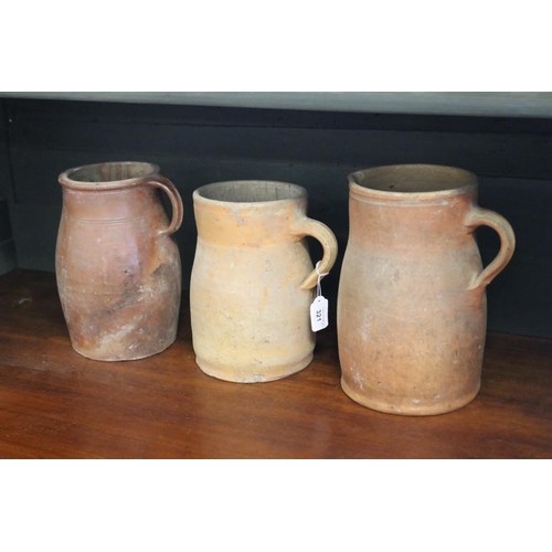 321 - Three antique French stoneware jugs, approx 27cm H and shorter (3)