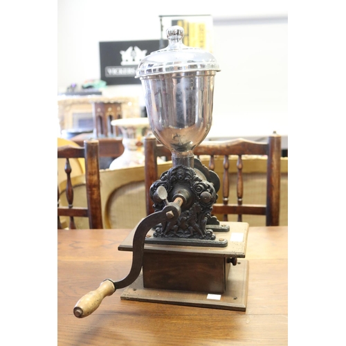 335 - Antique French coffee grinder, with ornate base, mounted to wooden drawer, approx 48cm H