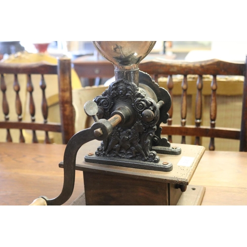 335 - Antique French coffee grinder, with ornate base, mounted to wooden drawer, approx 48cm H