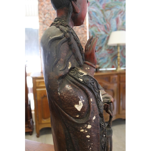 258 - Large red lacquered wood figure of Guanyin, some losses and flaking, approx 93cm H