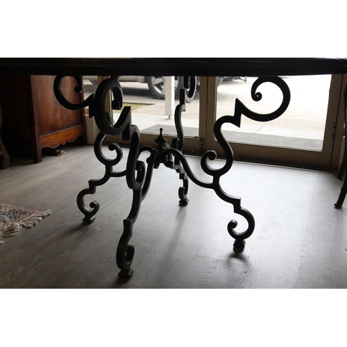 326 - Antique style circular wooden topped dining table with wrought iron base, approx 76cm H x 142cm Dia