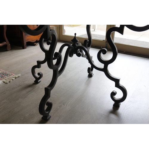 326 - Antique style circular wooden topped dining table with wrought iron base, approx 76cm H x 142cm Dia