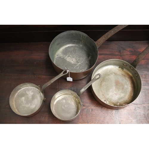423 - Three antique French copper and iron saucepans, approx 24cm Dia ex handle and smaller (3)