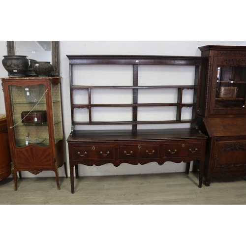 244 - Antique English George III oak three drawer dresser. Fitted with open shelf top with dental molded p... 