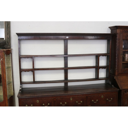 244 - Antique English George III oak three drawer dresser. Fitted with open shelf top with dental molded p... 