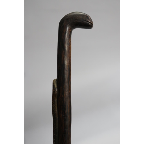 28 - Carved wood walking stick with snake motif, approx 94cm L