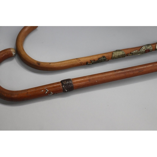 33 - Two walking sticks with mounts, approx 91cm L & shorter (2)