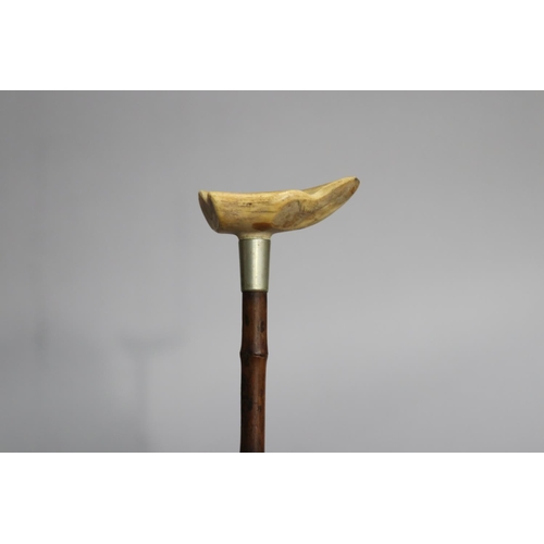 4 - Walking stick with a carved bone handle of floral motif, approx 88cm L