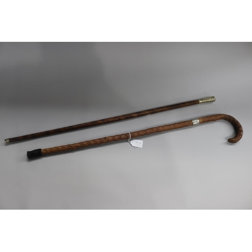 39 - Two silver mounted walking sticks, approx 80.5cm L & shorter (2)