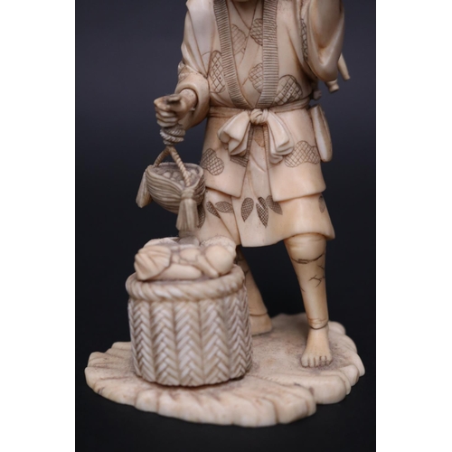 8 - Fine antique carved Japanese ivory okimono  of a farmer, holding tools & basket, approx 13.5cm H