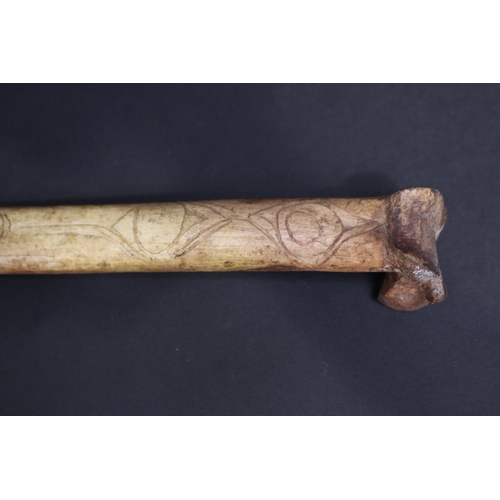 70 - Large old New Guinea carved bone dagger, Primative incised decoration, approx 41cm L