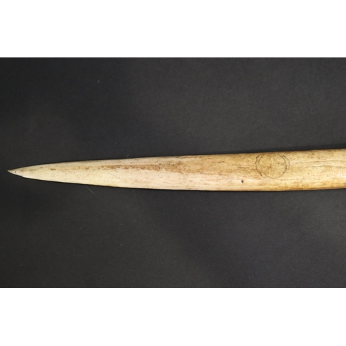 70 - Large old New Guinea carved bone dagger, Primative incised decoration, approx 41cm L