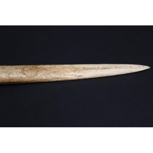 70 - Large old New Guinea carved bone dagger, Primative incised decoration, approx 41cm L