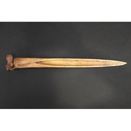 70 - Large old New Guinea carved bone dagger, Primative incised decoration, approx 41cm L